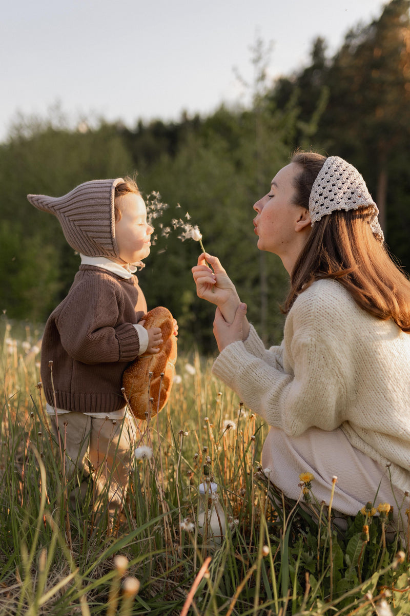 a woman with a baby in her hand